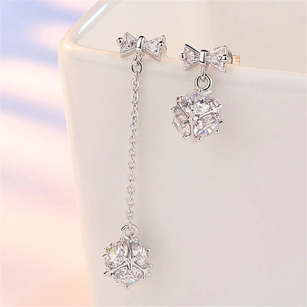Cubic Zirconia & Silver-Plated Bow Asymmetrical Drop Earrings