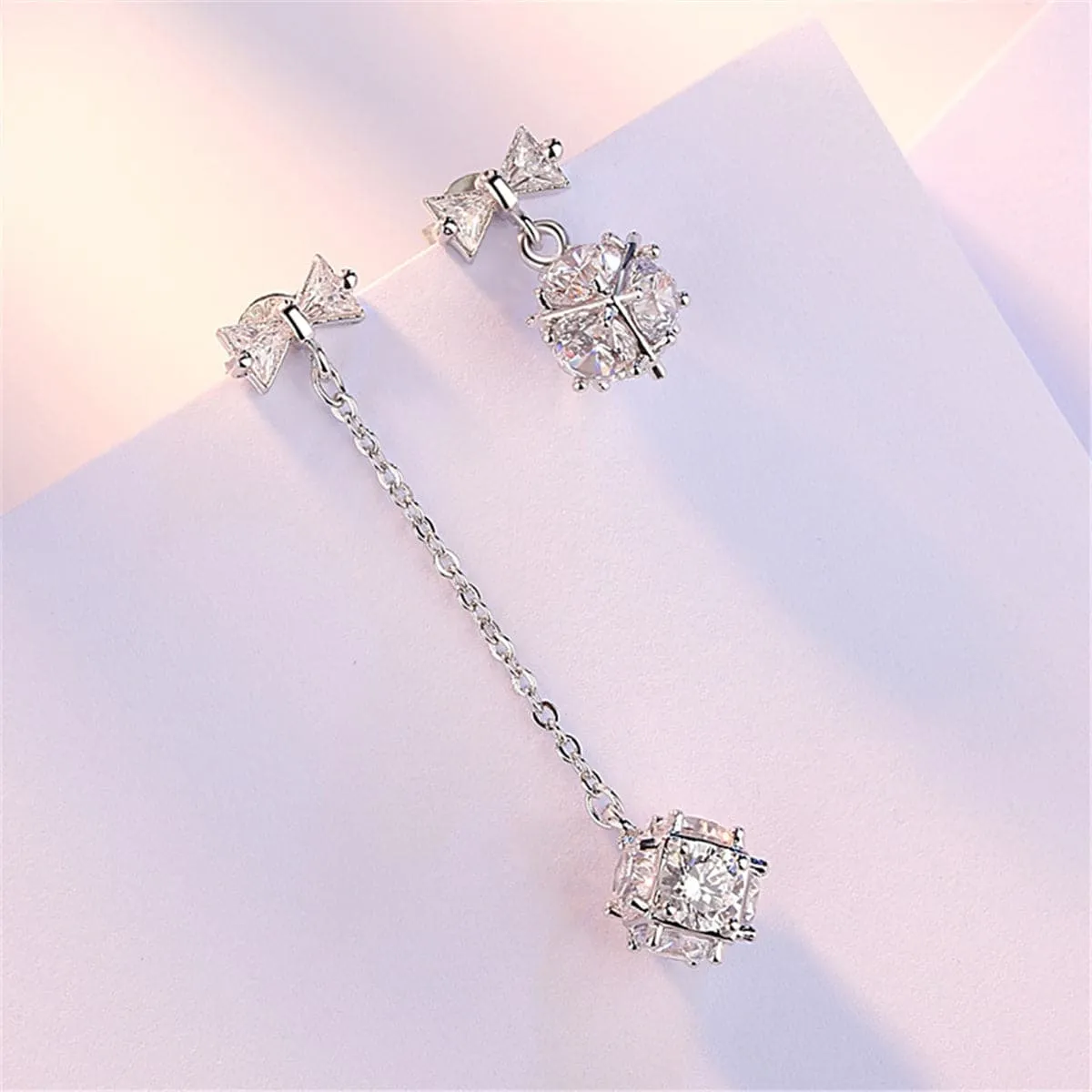 Cubic Zirconia & Silver-Plated Bow Asymmetrical Drop Earrings
