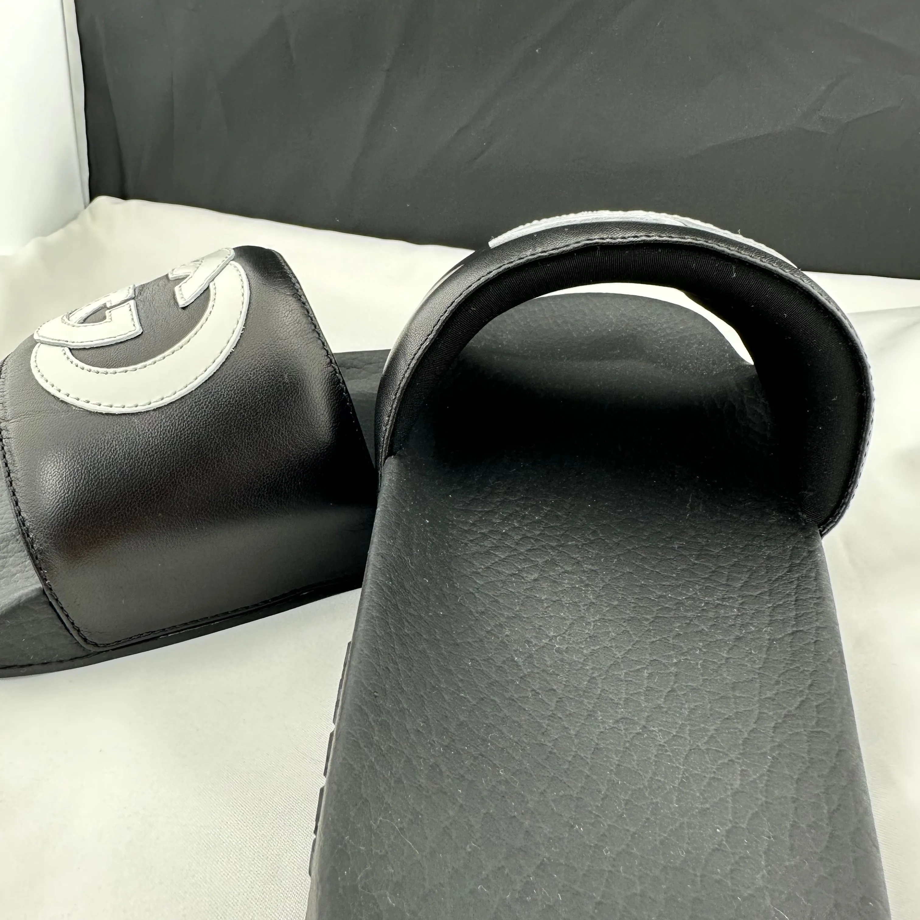 Gucci Men's Black Slides with White Interlocking GG