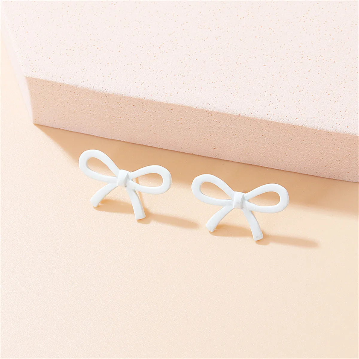White Enamel & Silver-Plated Open Bow Stud Earrings